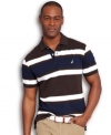 By land or by sea, this striped polo shirt from Nautica will keep you anchored in style.
