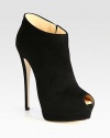 A trend-forward ankle boot in luxurious Italian suede with a towering heel, sturdy platform and sexy peep toe. Self-covered heel, 5¾ (145mm)Hidden platform, 1½ (40mm)Compares to a 4¼ heel (110mm)Suede upperPeep toeSide zipLeather lining and solePadded insoleMade in Italy