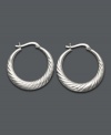Looking for style to last a lifetime? You can never go wrong with a simple pair of hoops. Giani Bernini earrings highlight a scalloped edge in sterling silver. Approximate diameter: 1 inch.