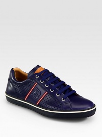 Express your sense of casual-cool style, with this low-cut sneaker crafted from smooth and perforated leather design with signature trainspotting side detail.Leather upperLeather liningPadded insoleRubber soleMade in Switzerland Express your sense of casual-cool style, with this low-cut sneaker crafted from smooth and perforated leather design with signature trainspotting side detail.Leather upperLeather liningPadded insoleRubber soleMade in Switzerland