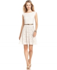 London Times' dress features crochet-style lace and a metallic belt to elevate the look. London Times' dress features crochet-style lace and a metallic belt to elevate the look.