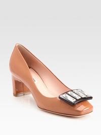 Patent leather design with a jeweled buckle and block heel. Self-covered heel, 2 (50mm)Patent leather and jewel upperLeather lining and solePadded insoleMade in ItalyOUR FIT MODEL RECOMMENDS ordering true size. Patent leather design with a jeweled buckle and block heel. Self-covered heel, 2 (50mm)Patent leather and jewel upperLeather lining and solePadded insoleMade in ItalyOUR FIT MODEL RECOMMENDS ordering true size.