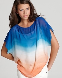 Covered in a vivid watercolor print, this GUESS top offers a gorgeous way to add color to your new-season lineup. Covered in a vivid watercolor print, this GUESS top offers a gorgeous way to add color to your new-season lineup.