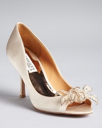 Feminine lace and crystal floral accents add textural interest to classic satin dress pumps from evening expert Badgley Mischka. Feminine lace and crystal floral accents add textural interest to classic satin dress pumps from evening expert Badgley Mischka.