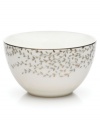 Fringed with shimmering leaves of platinum and mica, this bone china fruit bowl turns your table into a springtime utopia. Its sleek coupe shape is a vision of modern elegance in platinum-banded white.