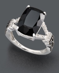 Make a bold style statement with chic, contrasting colors. Ring highlights a rectangular onyx stone (13 mm x 9 mm) with white diamond accents at the sides and round-cut black diamonds (1/8 ct. t.w.) at the band. Crafted in sterling silver. Size 7.