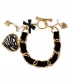 Stunning stripes. This toggle bracelet from Betsey Johnson is crafted from antique gold-tone mixed metal with a black ribbon and different accents, including a black and white zebra-striped heart for some animal attraction. Item comes packaged in a signature Betsey Johnson Gift Box. Approximate length: 7-1/2 inches.