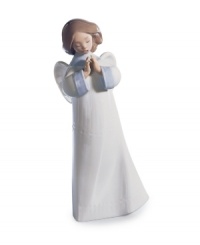 Fill your home with good spirits. With her hands together in prayer and mouth open in song, this Lladro angel figurine exudes quiet grace in handcrafted porcelain.
