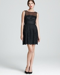 A sheer neckline lends allure to a classic dress in ladylike lace. From Trina Turk. A sheer neckline lends allure to a classic dress in ladylike lace. From Trina Turk.