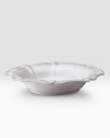 A beautiful stoneware bowl is handcrafted with elegant curves to bring rustic detail and irresistibly romantic European charm to a dinner or party. 80-ounce capacity 5H X 15½ diam. Dishwasher and oven safe Imported