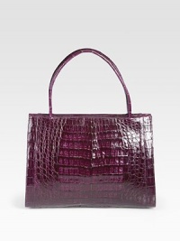 Luxurious crocodile top-handle design, perfectly sized for all your essentials.Double top handles, 5½ dropOpen topThree inner compartments; one zippered and two openOne inside zip pocketTwo inside open pocketsTwo pen holdersSuede lining11W X 8½H X 5DMade in Italy Luxurious crocodile top-handle design, perfectly sized for all your essentials.Double top handles, 5½ dropOpen topThree inner compartments; one zippered and two openOne inside zip pocketTwo inside open pocketsTwo pen holdersSuede lining11W X 8½H X 5DMade in Italy