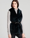 Layer a pop of color and personality over your favorite sweater or jacket with this Ellen Tracy colored faux fur vest.