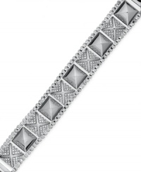 Style that's off the chain. Sleek studs are adorned with pave crystals on this chic box-chain bracelet from Juicy Couture. Crafted in silver tone brass. Approximate length: 6-1/3 inches. Style that's off the chain. Sleek studs are adorned with pave crystals on this chic box-chain bracelet from Juicy Couture. Crafted in silver tone brass. Approximate length: 6-1/3 inches.