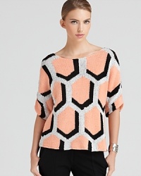 A three-dimensional hexagonal print lends a mesmerizing look to this chicly-knit DIANE von FURSTENBERG sweater. A three-dimensional hexagonal print lends a mesmerizing look to this chicly-knit DIANE von FURSTENBERG sweater.