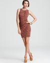 Dramatic side ruching enlivens an animal-print MICHAEL Michael Kors dress. Style with layered neutrals for a roaring fashion statement.