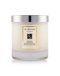 The scent of clementine leaves in the morning dew sparkles above a heart of orange blossom and water lily, transporting the wearer to a garden oasis. The Orange Blossom Home Candle infuses any room with evocative scent and lasts for hours. An everyday luxury, it brings warmth to any environment. 200g. The scent of clementine leaves in the morning dew sparkles above a heart of orange blossom and water lily, transporting the wearer to a garden oasis. The Orange Blossom Home Candle infuses any room with evocative scent and lasts for hours. An everyday luxury, it brings warmth to any environment. 200g.