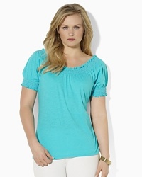 Imbued with breezy bohemian style, a soft cotton jersey top gets a romantic update with a smocked neckline and cuffs. Imbued with breezy bohemian style, a soft cotton jersey top gets a romantic update with a smocked neckline and cuffs.