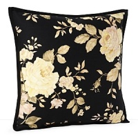 Silhouetted blossoms cascade across a bold black ground with hints of sage, pale yellow and rose, trimmed with a feminine ruffle. Silhouetted blossoms cascade across a bold black ground with hints of sage, pale yellow and rose, trimmed with a feminine ruffle.