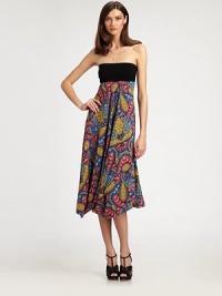 A colorful, ethnic-inspired print decorates this strapless, tea-length design.StraplessEmpire waistGathered skirtBubble hemlineFully linedAbout 30 from natural waist94% silk/6% spandexDry cleanImportedModel shown is 5'11 (180cm) wearing US size Small. A colorful, ethnic-inspired print decorates this strapless, tea-length design.StraplessEmpire waistGathered skirtBubble hemlineFully linedAbout 30 from natural waist94% silk/6% spandexDry cleanImportedModel shown is 5'11 (180cm) wearing US size Small.