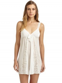THE LOOKSemi-sheer designV-neckLace straps with contrast underlayElastic, gathered Empire waist with bow detailLace panels with contrast underlayV-backTHE FITAbout 33 from shoulder to hemTHE MATERIALPolyester/rayonCARE & ORIGINMachine washImportedModel shown is 5'9 (175cm) wearing US size Small. THE LOOKSemi-sheer designV-neckLace straps with contrast underlayElastic, gathered Empire waist with bow detailLace panels with contrast underlayV-backTHE FITAbout 33 from shoulder to hemTHE MATERIALPolyester/rayonCARE & ORIGINMachine washImportedModel shown is 5'9 (175cm) wearing US size Small.