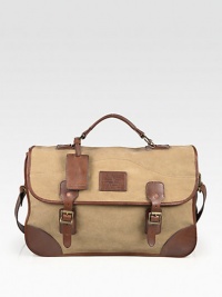 Versatile, with signature-style, finished in lightweight, cotton canvas trimmed in smooth leather.Top handleFlap, buckle closureAttached shoulder strapInterior slip compartments18W x 11H x 5½DImported Versatile, with signature-style, finished in lightweight, cotton canvas trimmed in smooth leather.Top handleFlap, buckle closureAttached shoulder strapInterior slip compartments18W x 11H x 5½DImported