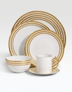 A beautiful charger in fine Limoges porcelain, made entirely by hand and finished with individually-applied 14k gold along the pearl border. From the Perlee Gold Collection Porcelain 12½ diam. Dishwasher safe Imported 