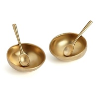 Gleaming in gold, these salt and pepper cellars from Donna Karan Lenox add a dose of organic glamour to the table. Gleaming in gold, these salt and pepper cellars from Donna Karan Lenox add a dose of organic glamour to the table.