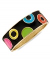Colorful chic. This bangle bracelet from Betsey Johnson is crafted from gold-tone mixed metal and features vibrant circles and dots on a black background for added appeal. Approximate diameter: 2-1/4 inches.
