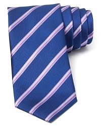 A perfect balance of classic and modern, with a handsome and traditional stripe pattern crafted with an on-trend skinny width, this tie transitions seamlessly from work to a downtown art opening or dinner with clients. A perfect balance of classic and modern, with a handsome and traditional stripe pattern crafted with an on-trend skinny width, this tie transitions seamlessly from work to a downtown art opening or dinner with clients.
