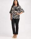 Made from irresistible Italian silk, this zebra-print top offers you a comfortable fit, thanks to convenient side slits. Round neckElbow-length sleevesConcealed button placketPull-on styleAllover printRelaxed fitSide slitsAbout 32 from shoulder to hemSilkDry cleanImported of Italian fabric