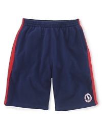 A preppy short rendered from soft cotton mesh is accented with side-seam stripes and a signature Ralph Lauren pony emblem, celebrating Team USA's participation in the 2012 Olympics. A preppy short rendered from soft cotton mesh is accented with side-seam stripes and a signature Ralph Lauren pony emblem, celebrating Team USA's participation in the 2012 Olympics.