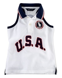 A red, white and blue design finished with U.S.A. patching and embroidered emblems gives a preppy all-American look to the classic sleeveless polo, celebrating Team USA's participation in the 2012 Olympics. A red, white and blue design finished with U.S.A. patching and embroidered emblems gives a preppy all-American look to the classic sleeveless polo, celebrating Team USA's participation in the 2012 Olympics.