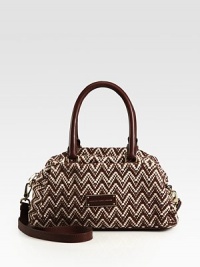 A graphic print adds a touch of retro-femininity to this soft cotton blend design with sleek leather accents. Double leather top handles, 7 dropAdjustable, detachable leather shoulder strap, 21½-25 dropTop zip closureOne outside open pocketOne inside zip pocketTwo inside open pocketsFully lined11¼W X 7¼H X 6¼DImported A graphic print adds a touch of retro-femininity to this soft cotton blend design with sleek leather accents. Double leather top handles, 7 dropAdjustable, detachable leather shoulder strap, 21½-25 dropTop zip closureOne outside open pocketOne inside zip pocketTwo inside open pocketsFully lined11¼W X 7¼H X 6¼DImported
