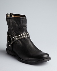 Rich, rugged leather, vintage-style studs; Frye shows off its mastery of Western style in these harness booties. Rich, rugged leather, vintage-style studs; Frye shows off its mastery of Western style in these harness booties.