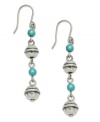 Walk the line this season. Varied sizes of silver tone and reconstituted turquoise beads combine on Lauren by Ralph Lauren's linear drop earrings. Crafted in antiqued silver tone mixed metal. Hangs on fish wire. Approximate drop: 1-1/2 inches.