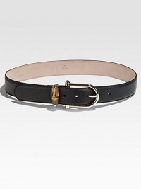 A graceful golden horsebit with a bamboo keeper on a pebble-textured leather strap.Width, about 1½Made in Italy A graceful golden horsebit with a bamboo keeper on a pebble-textured leather strap.Width, about 1½Made in Italy