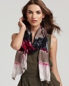 A boho-chic tie dye scarf with baby fringe edges.