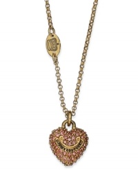 Think pink. This lovely pendant necklace from Juicy Couture adds feminine grace with pink-colored pave crystals. Crafted in gold tone mixed metal. Approximate length: 16 inches + 3-inch extender. Approximate drop: 1/2 inch. Think pink. This lovely pendant necklace from Juicy Couture adds feminine grace with pink-colored pave crystals. Crafted in gold tone mixed metal. Approximate length: 16 inches + 3-inch extender. Approximate drop: 1/2 inch.