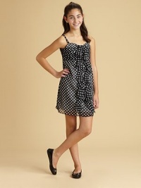 Inspire awes in this absolutely radiant, polka dot chiffon sundress, adorned with a delightful rosette detail.V-NeckSleevelessBack zipperFull skirtPolyesterHand wash cold or dry cleanImported Inspire awes in this absolutely radiant, polka dot chiffon sundress, adorned with a delightful rosette detail.V-NeckSleevelessBack zipperFull skirtPolyesterHand wash cold or dry cleanImported