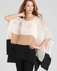The flowing silhouette of this DKNY cold shoulder poncho blouse creates elegant movement in your wake. Dress is down for day and up for evening, the styling options are infinite. The flowing silhouette of this DKNY cold shoulder poncho blouse creates elegant movement in your wake. Dress is down for day and up for evening, the styling options are infinite.