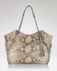 A haute bohemian tote from MICHAEL Michael Kors with gleaming hardware and decorative tassel detail in goes-with-everthing python leather.