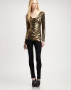 Shimmer away in this fitted metallic top with long sleeves and an asymmetrical cowlneck. Asymmetrical cowlneckLong sleeves95% polyester/5% spandexDry cleanMade in USA of imported fabricModel shown is 5'9½ (176cm) wearing US size Small.