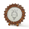 Olivia Riegel 4 1/2 round orange frame. Exquisitely hand-crafted with dazzling display of faux topaz stones, recalling the court of England's Elizabeth I.