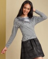 A classic striped top is emboldened by sequins at the neckline in this look from Tommy Hilfiger. Pair it with a metallic skirt to turn up the shine!