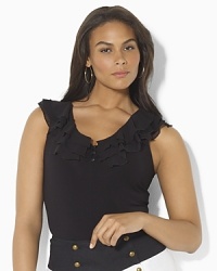 A sleeveless tank exudes feminine panache, accented with a multi-tier ruffled neckline and rendered in an ultra-soft lustrous knit for timeless style. A sleeveless tank exudes feminine panache, accented with a multi-tier ruffled neckline and rendered in an ultra-soft lustrous knit for timeless style.