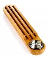 Bread winner. This long, wooden bread board shows off crusty, just-baked baguettes and loaves with a slatted surface and built-in crumb catcher. Fill the dip bowl with garlic oil or melted butter.