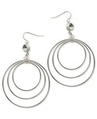 A trio of hoops in differing sizes complement the shimmering crystal accents and Quatro G logo charms on these earrings from GUESS. Crafted in silver tone mixed metal. Approximate drop: 2-3/4 inches. Approximate diameter: 2 inches. A trio of hoops in differing sizes complement the shimmering crystal accents and Quatro G logo charms on these earrings from GUESS. Crafted in silver tone mixed metal. Approximate drop: 2-3/4 inches. Approximate diameter: 2 inches.