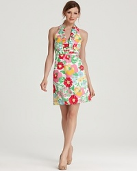 Blooming with preppy charm, this Lilly Pulitzer dress pairs a ruffled halter neck with vivid florals for classic feminine style. Blooming with preppy charm, this Lilly Pulitzer dress pairs a ruffled halter neck with vivid florals for classic feminine style.