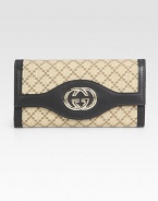 Signature logo jacquard in a foldover silhouette, finished with leather trim and GG hardware.Magnetic snap flap pocketCenter zip pocketTwo inner compartmentsThirteen credit card slotsFully lined7½W X 4H X 1¼DMade in Italy