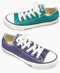Classic cool. These versatile Chuck Taylor sneakers from Converse add a comfortable hint of cool to their casual style. Classic cool. These versatile Chuck Taylor sneakers from Converse add a comfortable hint of cool to their casual style.